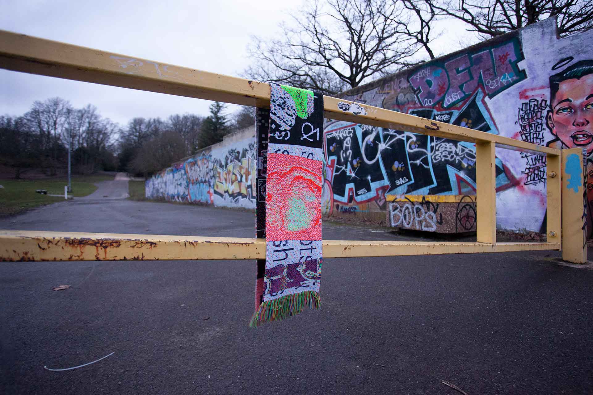 One of the scarves hanging from a gate