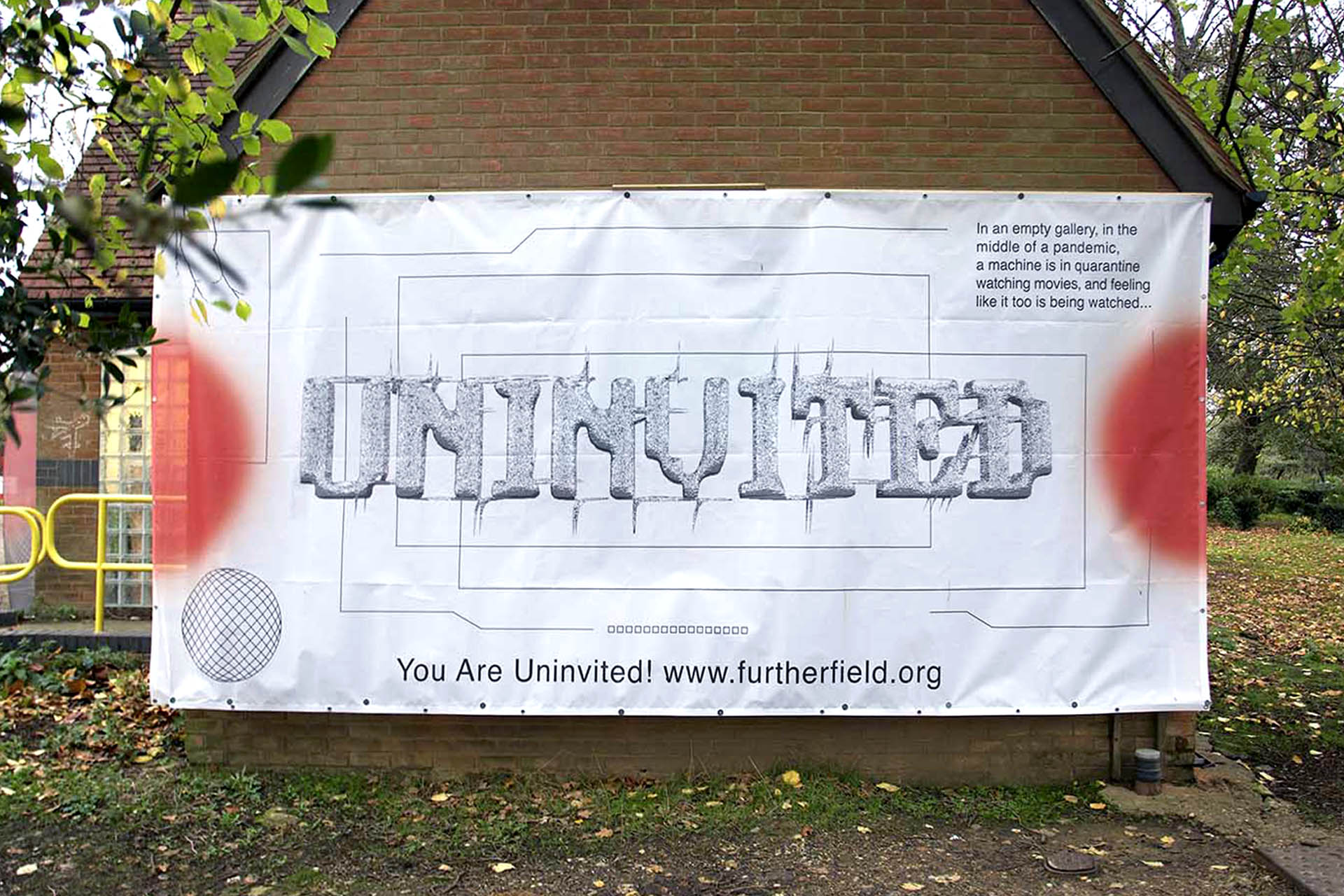 A closer view of the Uninvited hoardings, this white hoarding has bright red circles and some information about the machine in quarantine watching movies